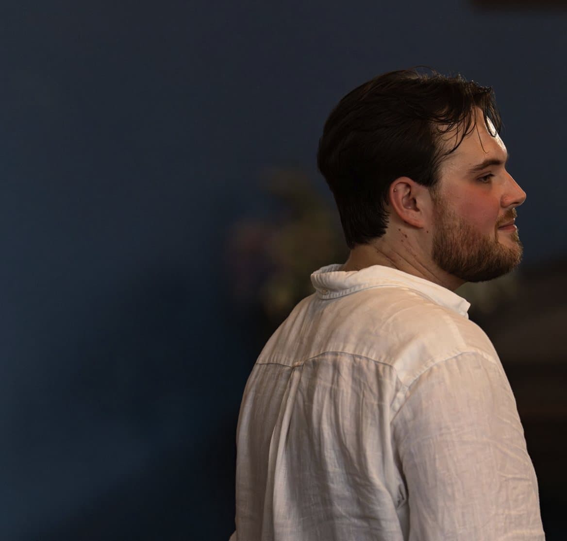 The director in profile, watching the ensemble